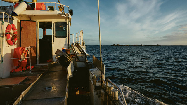 Morning sun on fishing boat in the arctic