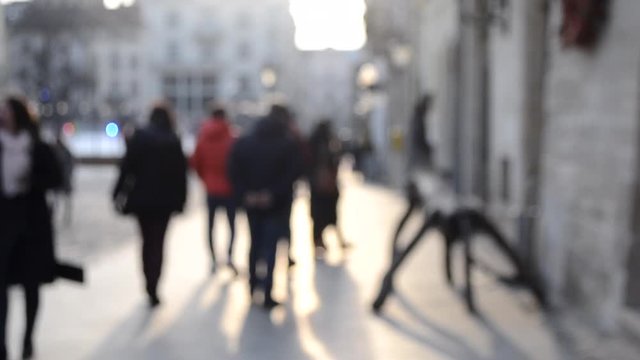 Abstract Defocused Blurred Background of many people on street square