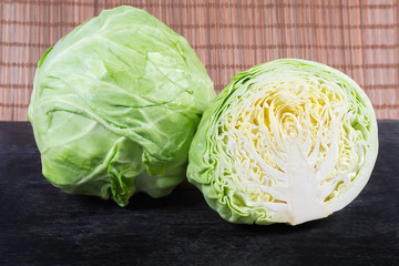 Whole and half of the young white cabbage heads