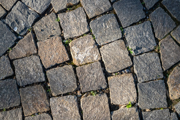 Granite background paving the sidewalk, pathway. Alley, a place to relax in the city. close-up