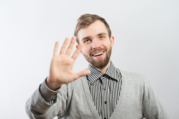 young man waving