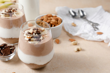 Chia seeds pudding with chocolate and banana smoothie in a glass