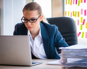 Beautiful female employee with many conflicting priorities
