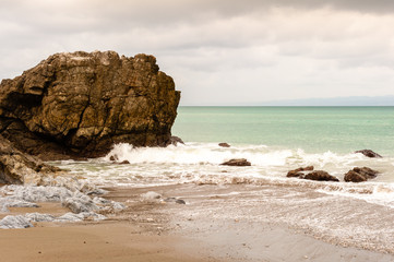 Fototapeta na wymiar Rock on a tropical beach