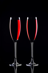 Two wine glasses with red wine.