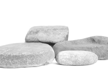 Small stones arranged at different heights in white tones