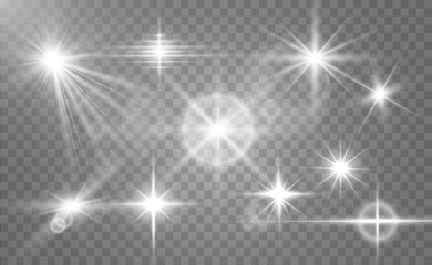 A set of bright beautiful stars. Light effect. Bright Star. Beautiful light for illustration. Christmas star.White sparkles shine special light effect. Vector sparkles on a transparent background.