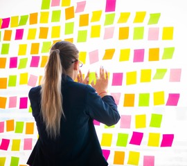 Beautiful female employee with many conflicting priorities