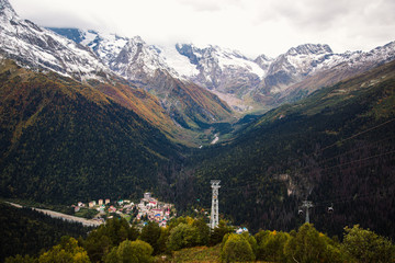Breathtaking view on Dombay mountains valley and rocky peaks of the glaciers, Russia, Caucasus autumn landscape.