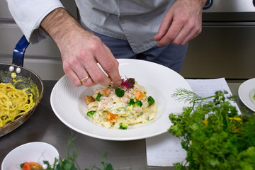 Obraz na płótnie Canvas Preparing broccoli salmon pasta