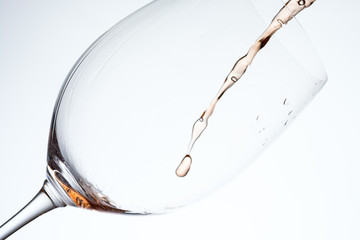 Splash of rose wine in a glass