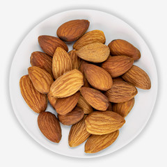 Almonds on a white plate. Isolated background. View from above.