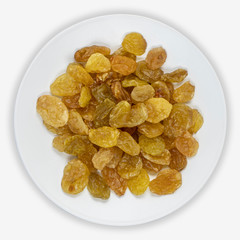 Raisins from green grapes on a white plate. Isolated background. View from above.