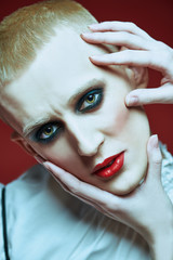 blonde boy with bright make up