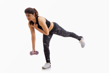 Woman working out with dumbbells and stretching.
