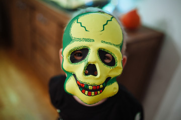 Boy in scary halloween mask