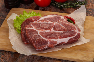 Raw pork neck steak