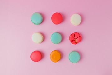 Beautiful colourful desserts. french macaroons on a pink background