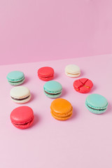 Beautiful colourful desserts. french macaroons on a pink background