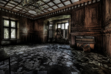 Abandoned room in an empty building with a large window