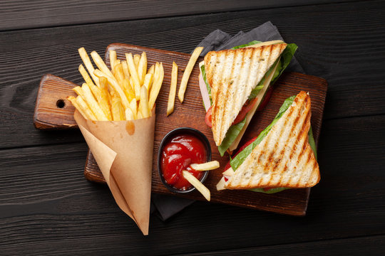 Potato fries and club sandwich