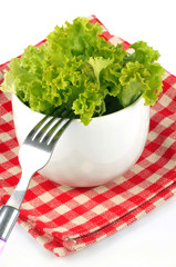 Bowl of escarole close-up with a fork