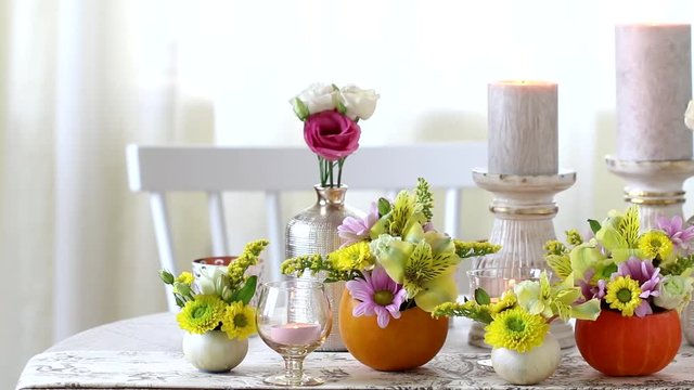 Romantic party table decorations with flowers and candles. 
