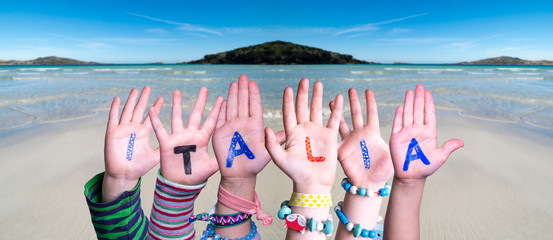 Children Hands Building Colorful Italian Word Italia Means Italy. Ocean And Beach As Background
