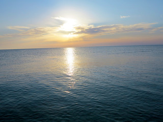 coast of the sea against the background of the sunset 