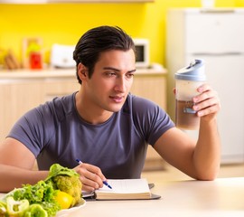 Young man in healthy eating concept