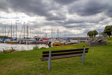Fototapeta na wymiar Lovely and cozy view on the water and boats with dynamic sky