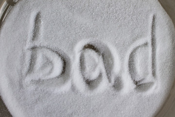 Bad, inscription on salt. Rejection of salty, diet and weight loss. Heart or pressure problems, harm from eating, dependence on flavoring. Superstitions and omens. Light background.