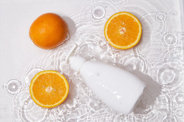 White bottle flacon cosmetics beauty product for skin care face cream and body lotion  shower gel natural organic cosmetology in water drop pure beautiful.