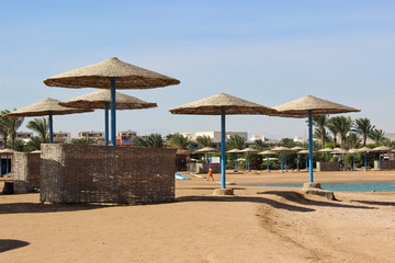 tropical beach with umbrellas