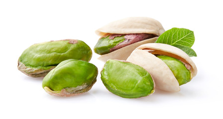 Pistachio with leaves on white background