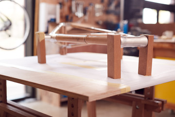 Hand Built Sustainable Bamboo Bicycle Frame Being Assembled In Workshop
