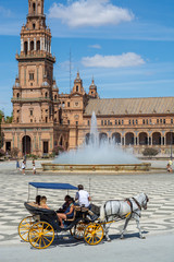 Obraz premium September 10, 2019, Sevilla, Andalusia, Spain, tourists on Square of Spain in hot sunny day