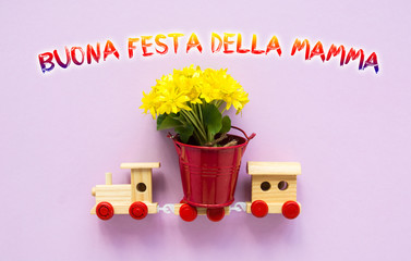 Happy Mother day text Love Greeting Card in italian, children's train toy carries a bouquet of flowers
