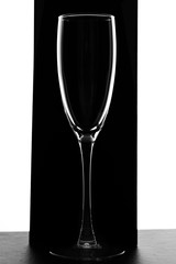 Empty luxury champagne glass isolated on a black background