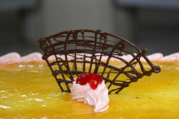 yellow jelly with decor on top of the cake