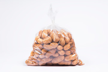 Fototapeta na wymiar Groundnuts packed in a transparent plastic bag. 