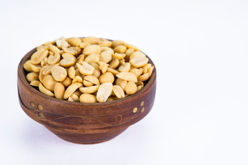 Roasted peanuts kept in a wooden bowl.  
