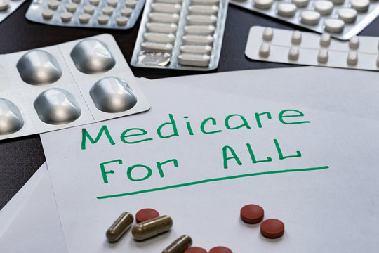 The Medicare For All Sign Is Written On The Sheet In Green Letters,