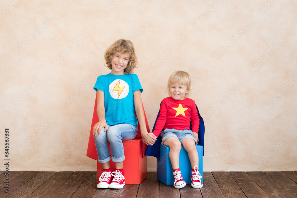 Wall mural superheroes children playing at home