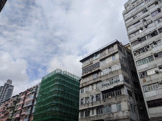 old building and bamboo building site  in hong kong