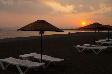 Sunset on the Calis Beach on the Aegean Sea