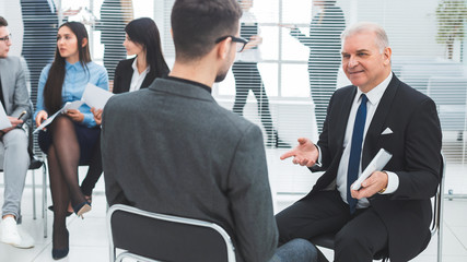 business man explaining something to his colleague.