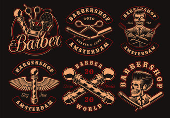 Set of vintage barbershop emblems on a dark background