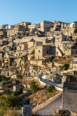Obraz premium View of the Sassi di Matera a historic district in the city of Matera, well-known for their ancient cave dwellings. Basilicata. Italy