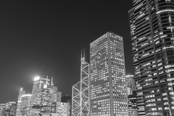 Modern office building and skyline of Hong Kong city at night